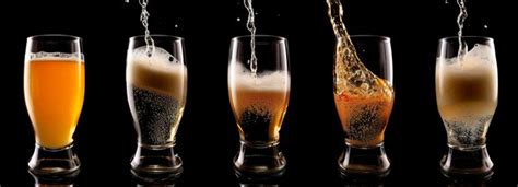 Premium Photo Pouring Beer Into A Glass On A Black Background