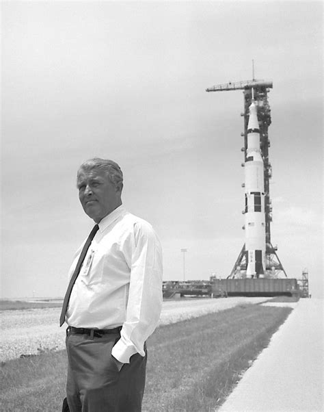 Dr. Wernher von Braun in front of the Apollo 11 Saturn V (1969) : r/nasa