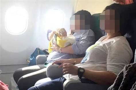 Beautiful Moment Plane Passenger Cradles Newborn In Her Arms After