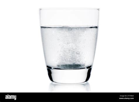 Medical Tablet Dropped Into The Water With Bubbles On White Background