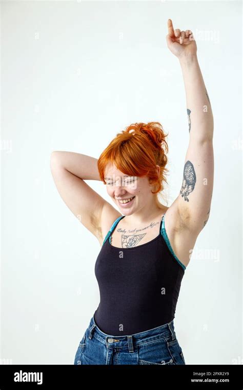 A Beautiful Woman In Her Mid Twenties With Tattoos And Unshaved Armpits