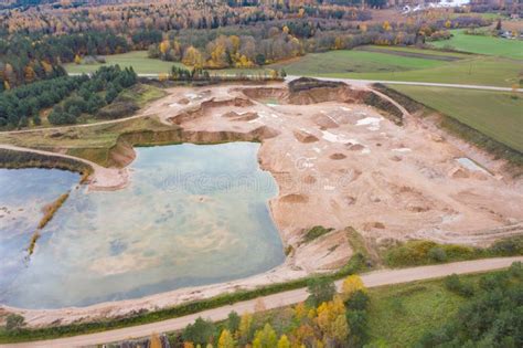 Aerial View Of An Opencast Sand Gravel Mine Quarry Full With Green