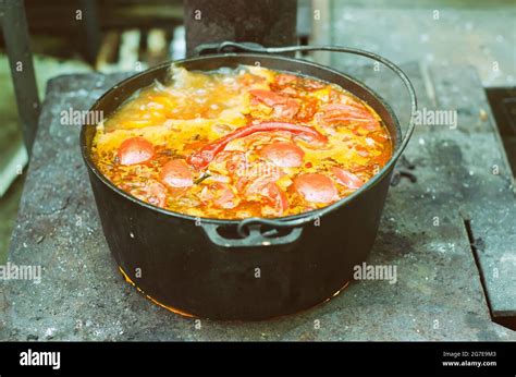 traditional soup cooking in cauldron Stock Photo - Alamy