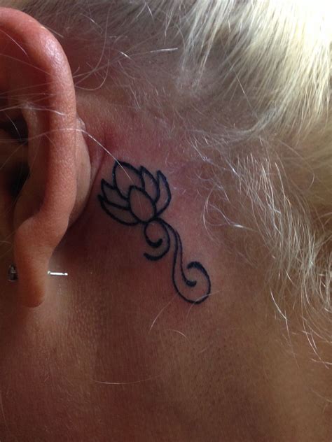 Simple Lotus Flower Tattoo Behind Ear