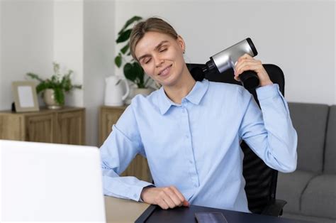 Free Photo Person Using Massage Gun