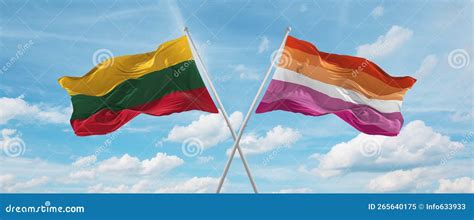 Two Crossed Flags Lesbian Pride And Lithuania Waving In Wind At Cloudy