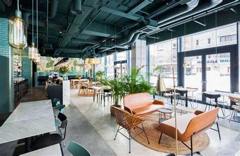 Industrial Style Restaurant with a Greenery-Themed Decor