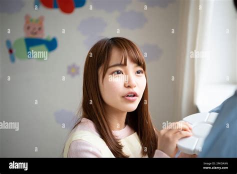 Nursery School Teacher Talking With A Preschooler Stock Photo Alamy