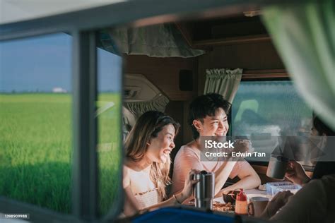 Asian Chinese Lesbian Couple And Friends Enjoying Breakfast In