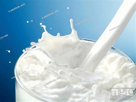 Milk Being Poured Into A Glass Stock Photo Picture And Rights Managed