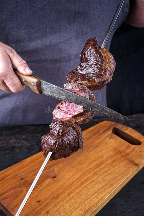 Traditional Barbecue Dry Aged Wagyu Brazilian Picanha Sliced By A Chef