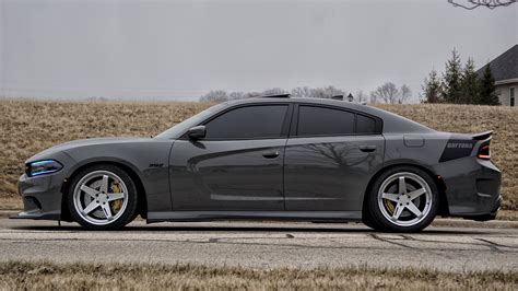 Stylish And Sinister Gray Dodge Charger Sitting On Gunmetal Rims By