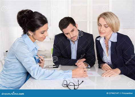 Business Meeting At Office With Three Business People Stock Image