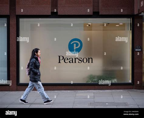 Commuters walking past Pearson education company headquarters in Central London, Pearson plc is ...