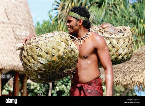 Honolulu Hawaii May 27 2016 A Samoan Man Carrying Coconuts In A