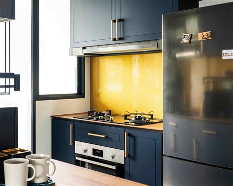 Yellow Lacquered Glass Backsplash For Bold Kitchen Tiles Design Livspace