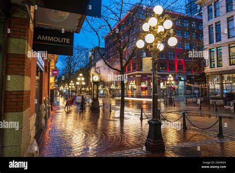 Gastown Steam Clock And Downtown Beautiful Street View On A Rainy Night