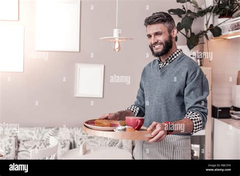 Happy Cheerful Man Bringing Food To The Table Stock Photo Alamy