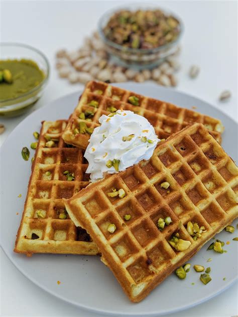 White Chocolate Pistachio Waffles Topped With White Chocolate Whipped