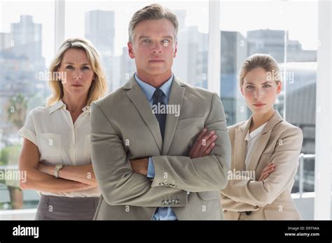 Three Business People Standing Together Stock Photo Alamy