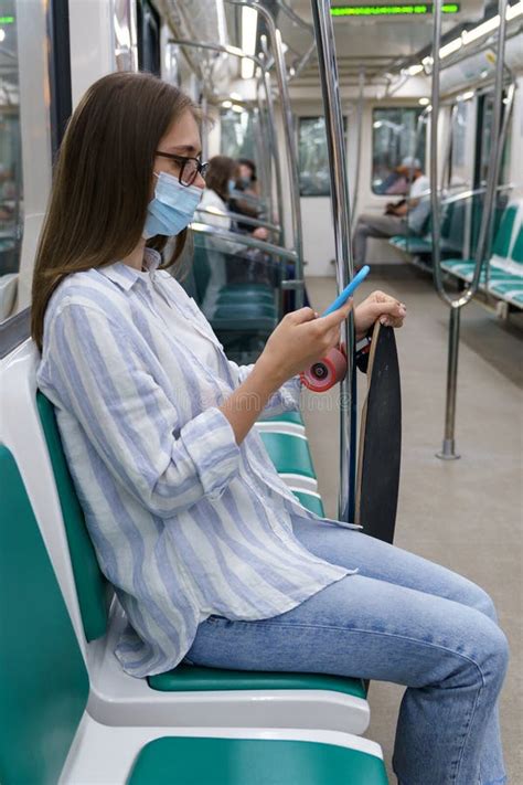 Millennial Woman Passenger Using Mobile Phone Wear Face Mask Against