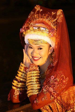 Brunei Lady in Traditional Costume by Charoonsak Sukawatano