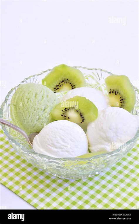 Vanilla Ice Cream And Kiwi Ice Cream With Slices Of Kiwi Fruit In A