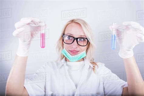 Scientist Holding Test Tubes Stock Photo Dissolve