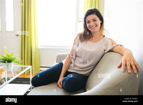 Nice Women Sit On The Sofa At Home Stock Photo Alamy