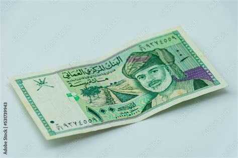 Oman riyal banknote on a white background. Selective focus. Stock Photo ...