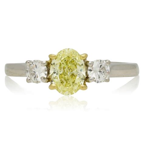 PRE-OWNED PLATINUM 3 STONE DIAMOND RING. NATURAL INTENSE YELLOW DIAMOND ...