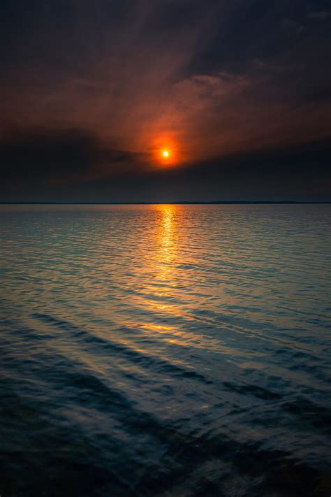 Sunset Sun Horizon Reflections Waves Hd Phone Wallpaper Peakpx