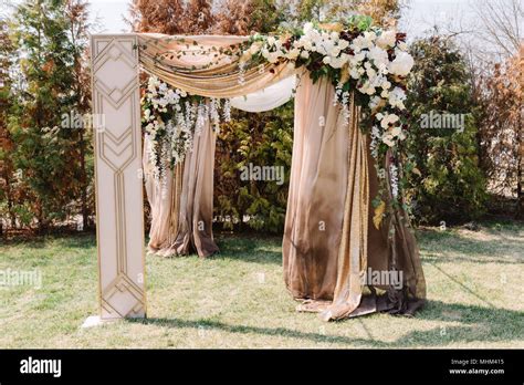 Arch For The Wedding Ceremony Decorated With Cloth And Flowers Stock