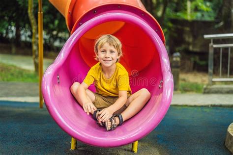 Funny Cute Happy Baby Playing On The Playground The Emotion Of
