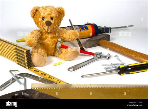 Teddy Bear Sitting Amid Home Repair Maintenance Construction Tools