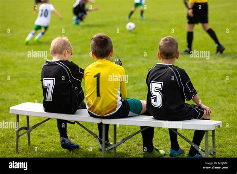 Soccer player sitting on bench hi-res stock photography and images - Alamy