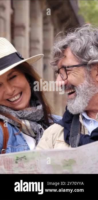 Vertical Senior Couple Smiling Look At City Map On Vacation Mature Happy Partner Enjoy Weekend