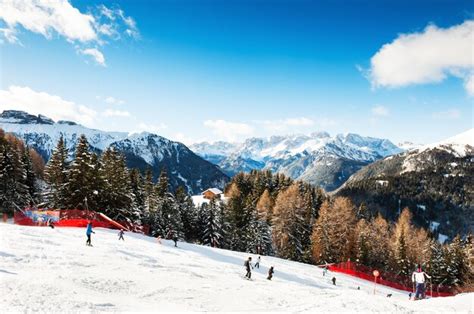 Premium Photo | Val di fassa ski resort, canazei, italy - january, 2, 2018: skiers skiing down ...