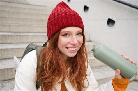 Premium Photo Happy Redhead Woman Tourist With Thermos Drinks Her Hot