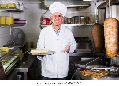 Mature Man Chef Wearing Uniform Holding Stock Photo 707081818