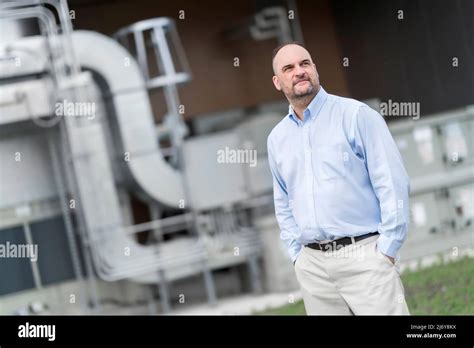 Visionary Man Standing Confidently In Front Of Plant Stock Photo Alamy