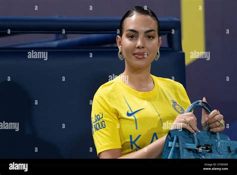 Georgina Rodriguez Poses On The Pitch With A Blue Birkin Alligator