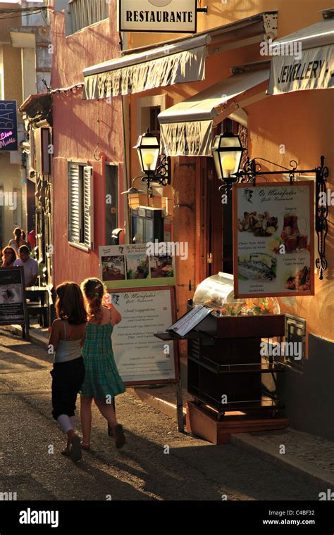 Alvor street with restaurants Algarve Portugal Stock Photo - Alamy