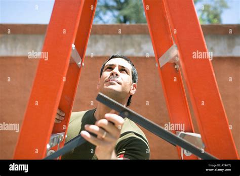 Man Collapsing Metal Ladder Stock Photo Alamy