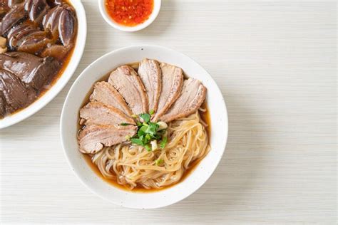 Premium Photo | Duck noodles with stewed duck soup