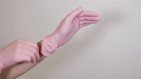 Professional Doctor Or Hygiene Beautician Wearing Pink Latex Gloves