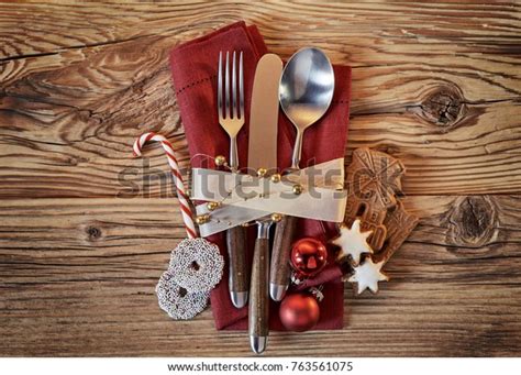 Christmas Place Setting With Cookies And Candy Cane Alongside A Red