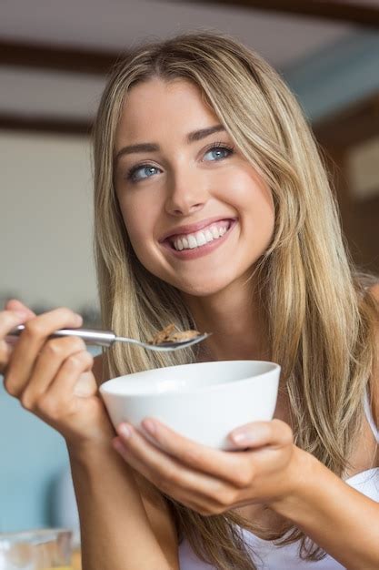 Premium Photo Cute Blonde Having Cereal For Breakfast