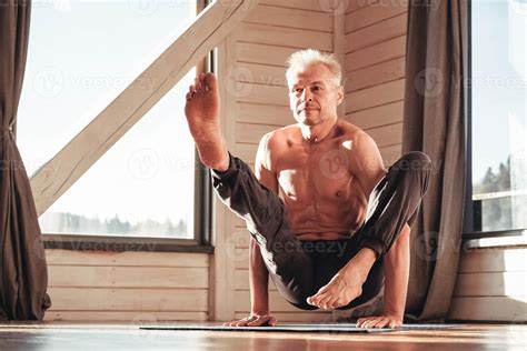 Senior Man With A Naked Torso Practicing Yoga Classic Asana Training In