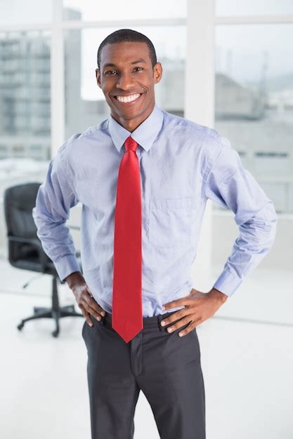 Premium Photo Elegant Smiling Afro Businessman Standing In Office